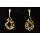 A PAIR OF 9CT GOLD SMOKEY QUARTZ DROP EARRINGS, each designed with a central oval smokey quartz