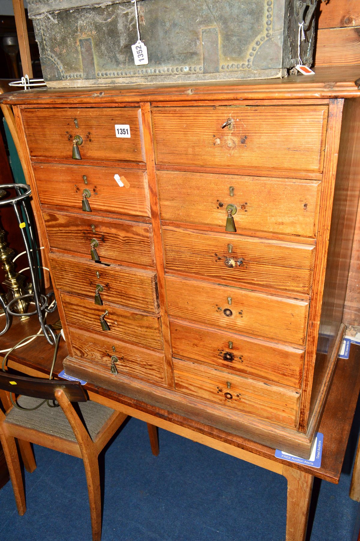 AN EARLY 20TH CENTURY PITCH PINE CHEST OF TWELVE DRAWERS, width 69cm x depth 46cm x height 73cm (