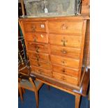 AN EARLY 20TH CENTURY PITCH PINE CHEST OF TWELVE DRAWERS, width 69cm x depth 46cm x height 73cm (