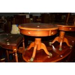 A REPRODUCTION CHERRYWOOD OVAL TOPPED COFFEE TABLE, with brass feet, together with a matching pair