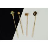 FOUR LATE 19TH TO EARLY 20TH CENTURY STICKPINS, rope twist knot design, faceted sphere, oval