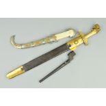 AN EASTERN STYLE POSSIBLY ARABIC SHORT HAND DAGGER, with ornate grip and white metal scabbard (