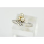 AN EARLY 20TH CENTURY PEARL AND DIAMOND TREFOIL CROSSOVER RING, ring size L, personal inscription on