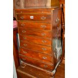 A SMALL REPRODUCTION MAHOGANY BOMBE CHEST OF SEVEN DRAWERS, with a brushing slide, width 45cm x