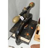A 19TH CENTURY CAST IRON AND BRASS BOOK PRESS, unmarked, having typical rise and fall mechanism,