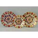 THREE ROYAL CROWN DERBY IMARI PLATES, '1128' pattern, diameters 21.5cm and two 27cm (3)