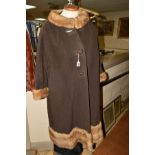 A LADIES LONG WOOL/FUR COAT, with mink fur trim collar, cuffs and hem, bears label for 'Woodward &