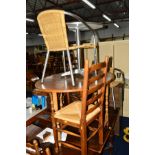 AN OAK DROP LEAF DINING TABLE, four rush seated ladder back chairs, a round stainless steel garden