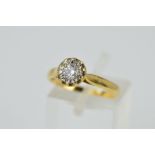 AN 18CT GOLD DIAMOND SINGLE STONE RING, the brilliant cut diamond within an illusion setting, with