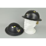 TWO WWII BLACK METAL 'ARP' STYLE HELMETS, one marked 'W' and the other marked 'A' (2)