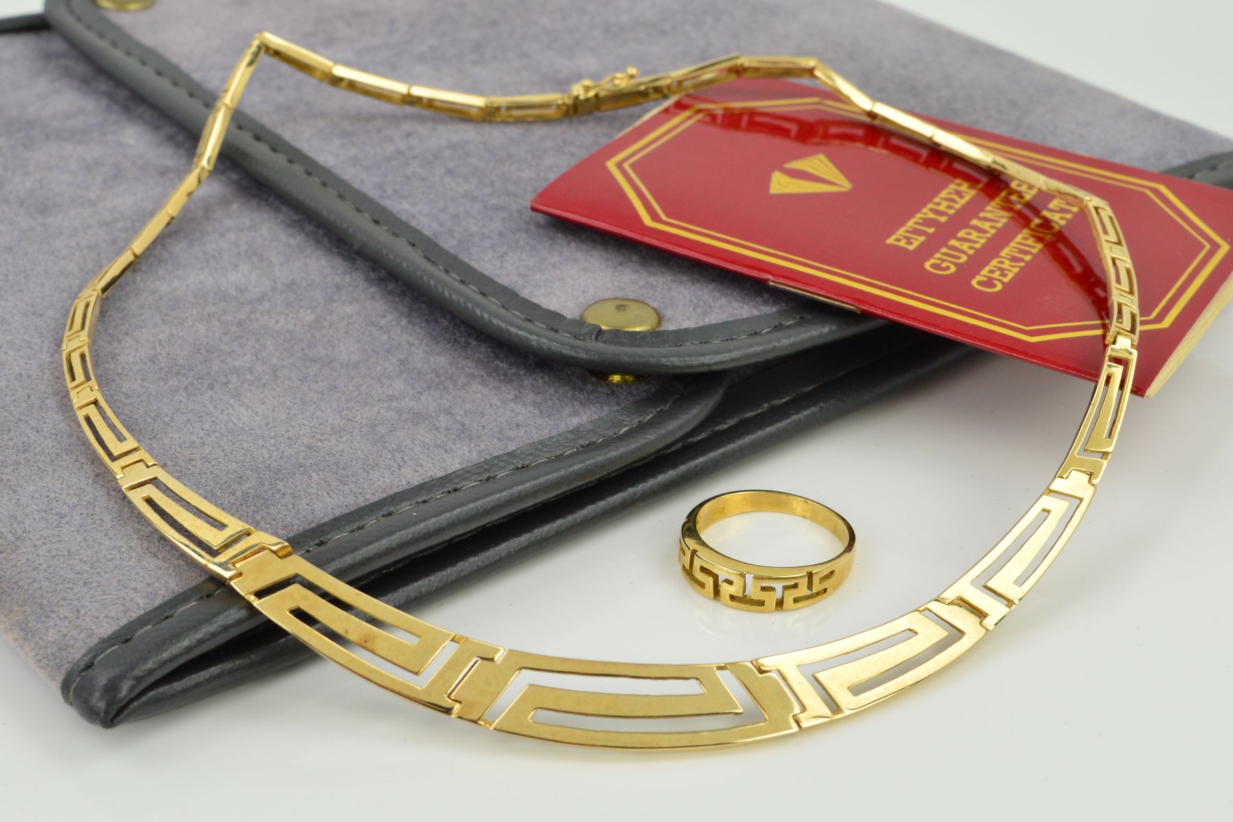 A MODERN GREEK KEY DESIGN COLLAR AND MATCHING RING, graduating panel links measuring approximately