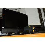 A HANNSPREE 32'' FSTV, together with a cyber home DVD player and a VHS player (3)