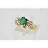 A MODERN EMERALD AND DIAMOND DRESS RING, ring size M, stamped '10k', approximate gross weight 2.4