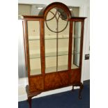 A LATE VICTORIAN WALNUT AND BANDED ASTRAGAL GLAZED SINGLE DOOR DISPLAY CABINET, with a central domed