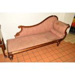 A REGENCY ROSEWOOD CHAISE LOUNGE, foliate and scrolled decoration on four shaped octagonal legs with