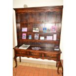 A REPRODUCTION GEORGIAN STYLE OAK DRESSER, the top section with triple plate rack above a base