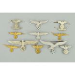 A COLLECTION OF ELEVEN WWII ERA GERMAN 3RD REICH METAL CAP BADGES, i.e. Eagle Swastika design, for