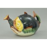 A MAJOLICA STYLE NOVELTY TEAPOT, shaped as a large fish swallowing a smaller fish, height