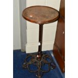 A LATE VICTORIAN CAST IRON CIRCULAR DISH TOPPED TABLE raised on a barley twist support with an