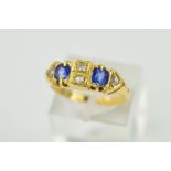 A VICTORIAN 18CT GOLD SAPPHIRE AND DIAMOND HALF HOOP RING, two cushion cut sapphires, measuring