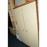A MODERN TWO DOOR WARDROBE, a matching dressing table, together with a modern open bookcase and