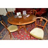 A VICTORIAN BURR WALNUT AND BANDED OVAL TILT TOPPED TABLE, the top with a rounded edge on base