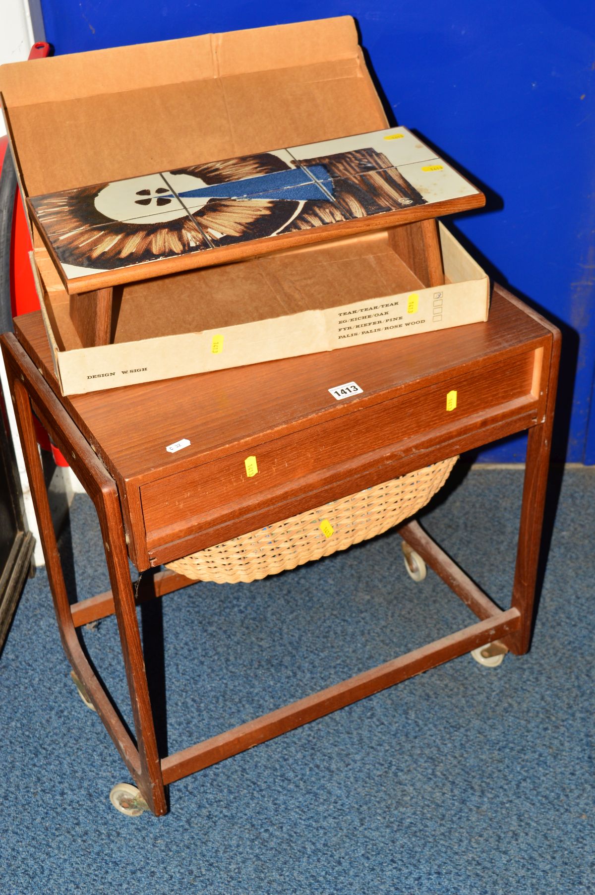 A DANISH STYLE TEAK SEWING TROLLEY with a single drawer and contents, together with a H Sigh and