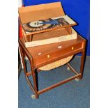 A DANISH STYLE TEAK SEWING TROLLEY with a single drawer and contents, together with a H Sigh and