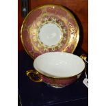 A BOXED ROYAL CROWN DERBY CREAM SOUP CUP AND STAND, A1359 'Heritage' pattern, pink and lilac