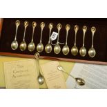 A CASED SET OF TWELVE SILVER RSPB SPOON COLLECTION, silver gilt finials, each with a bird cameo,