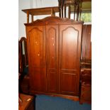 A REPRODUCTION CHERRYWOOD BEDROOM SUITE, comprising a three door wardrobe, width 137cm x depth