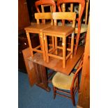 AN OAK DROP LEAF DINING TABLE, four stained chairs, two other chairs, stools and a walnut two door