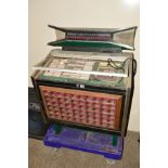 A ROWE AMI CADETTE MID CENTURY JUKEBOX, in need of restoration