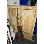 A DISTRESSED PAINTED VICTORIAN PINE PANELLED TWO DOOR CUPBOARD above two deep drawers, width 142cm x