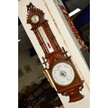 A CARVED OAK ANEROID BAROMETER/CLOCK AND THERMOMETER, height approximately 114cm (missing glass on