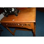 A REPRODUCTION GOLDEN OAK SIDE TABLE, with a single drawer, width 79cm x depth 46cm x height 69cm