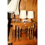 A REPRODUCTION OAK NEST OF THREE TABLES, together with three various table lamps (4)