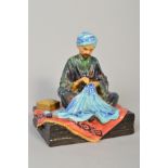 REG JOHNSON (1909-1993), a studio pottery figure 'Embroiderer of Kashmir' height approxmately