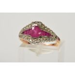 A RUBY AND DIAMOND DRESS RING, designed with a central oval ruby flanked by graduated rectangular
