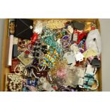 A BOX OF COSTUME JEWELLERY, to include a colourless paste and rolled gold ring, an enamel bangle,