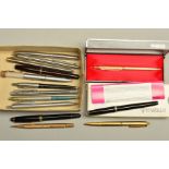 A SELECTION OF PENS, to include a cased gold coloured, engine turned Parker pen, a gold coloured