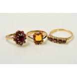 THREE GEM RINGS, the first a graduated five stone garnet ring with scrolling gallery, with 9ct