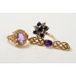 TWO RINGS AND A BROOCH, the first ring designed as an oval amethyst in a four claw setting within