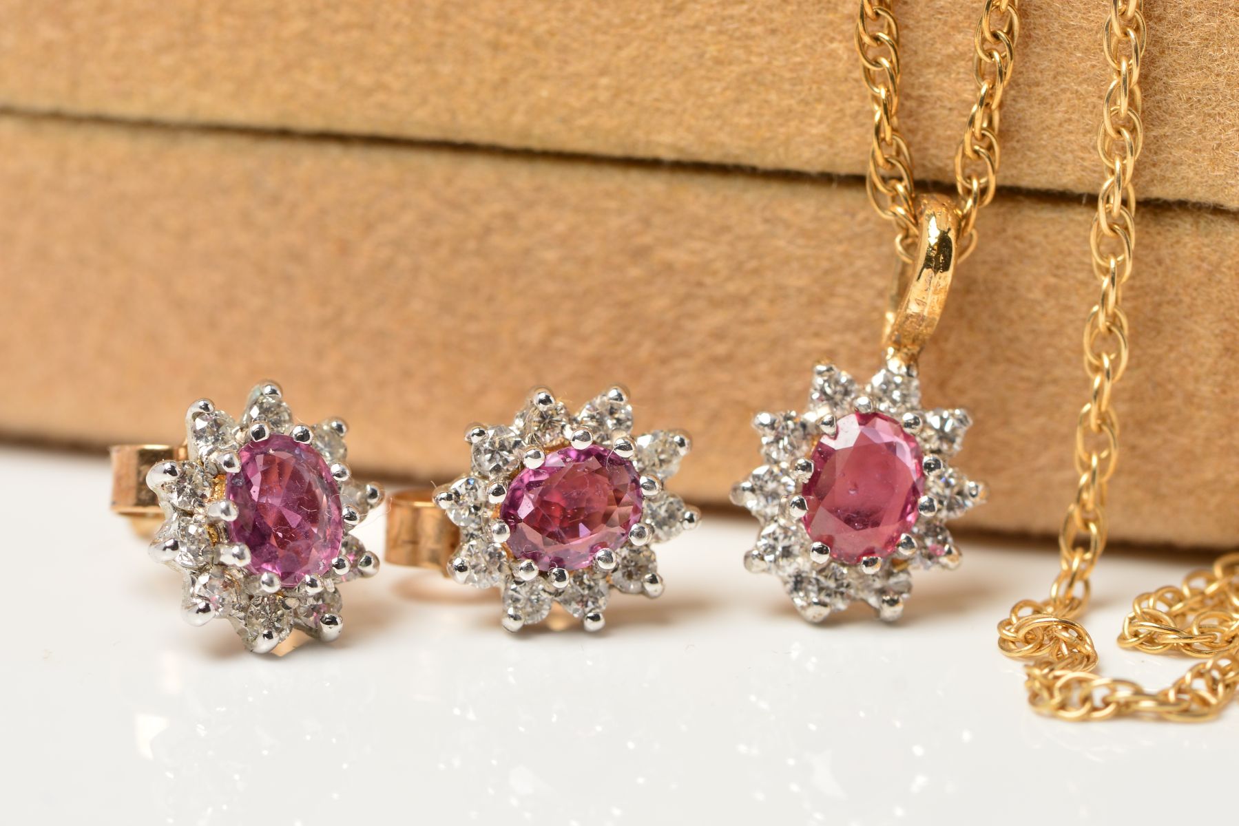 A 9CT GOLD RUBY AND DIAMOND PENDANT AND FINE CHAIN, measuring approximately 400mm in length,