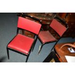 A SET OF FOUR METAL STACKING CHAIRS, stamped Exeloid