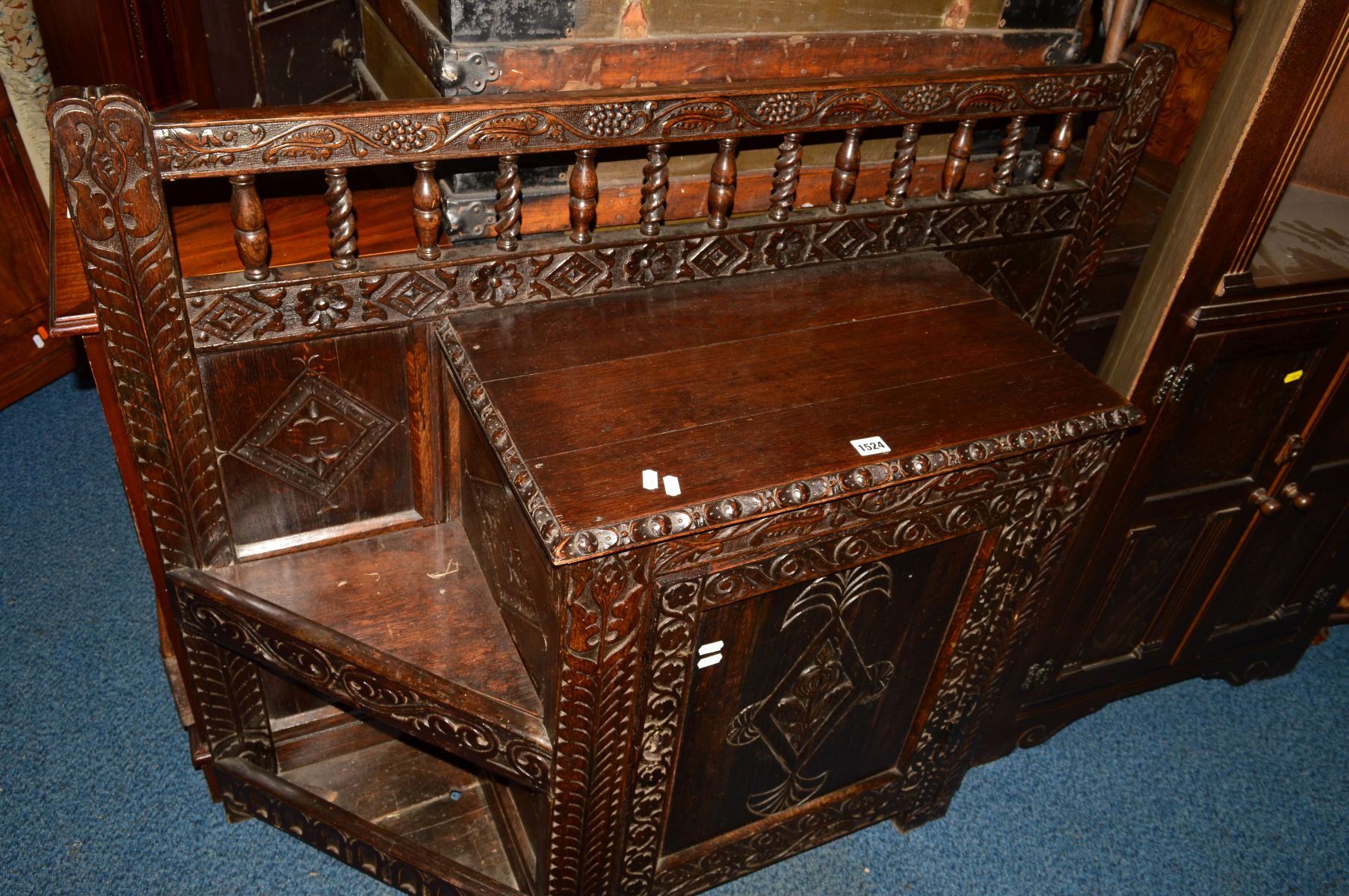 AN EARLY 20TH CENTURY OAK CANTED HALL STAND, carved with grapes, foliage and geometric decoration, - Image 2 of 3