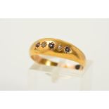 A LATE VICTORIAN 15CT GOLD SAPPHIRE AND DIAMOND RING, designed as a row of three circular