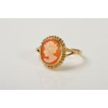 A 9CT GOLD CAMEO RING, the oval cameo depicting a lady in profile to the beaded surround and