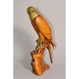 A MALEVOLTI SCULPTURE, bird of prey on tree stump, brass head and feet, signed on wing, height