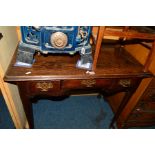 AN EARLY 20TH CENTURY GEORGIAN STYLE OAK LOWBOY, three various drawers raised on four padded legs,